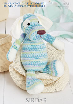 Sirdar 1458 Dog. Uses #3(double knitting) weight yarn. Model is knit in Sirdar Snuggly Crofter DK.